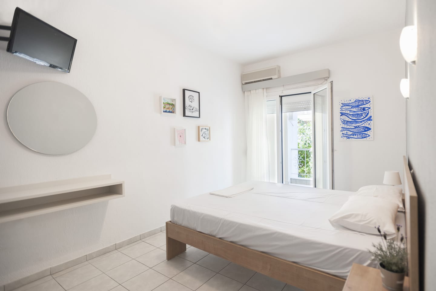 Double bed beside the balcony window